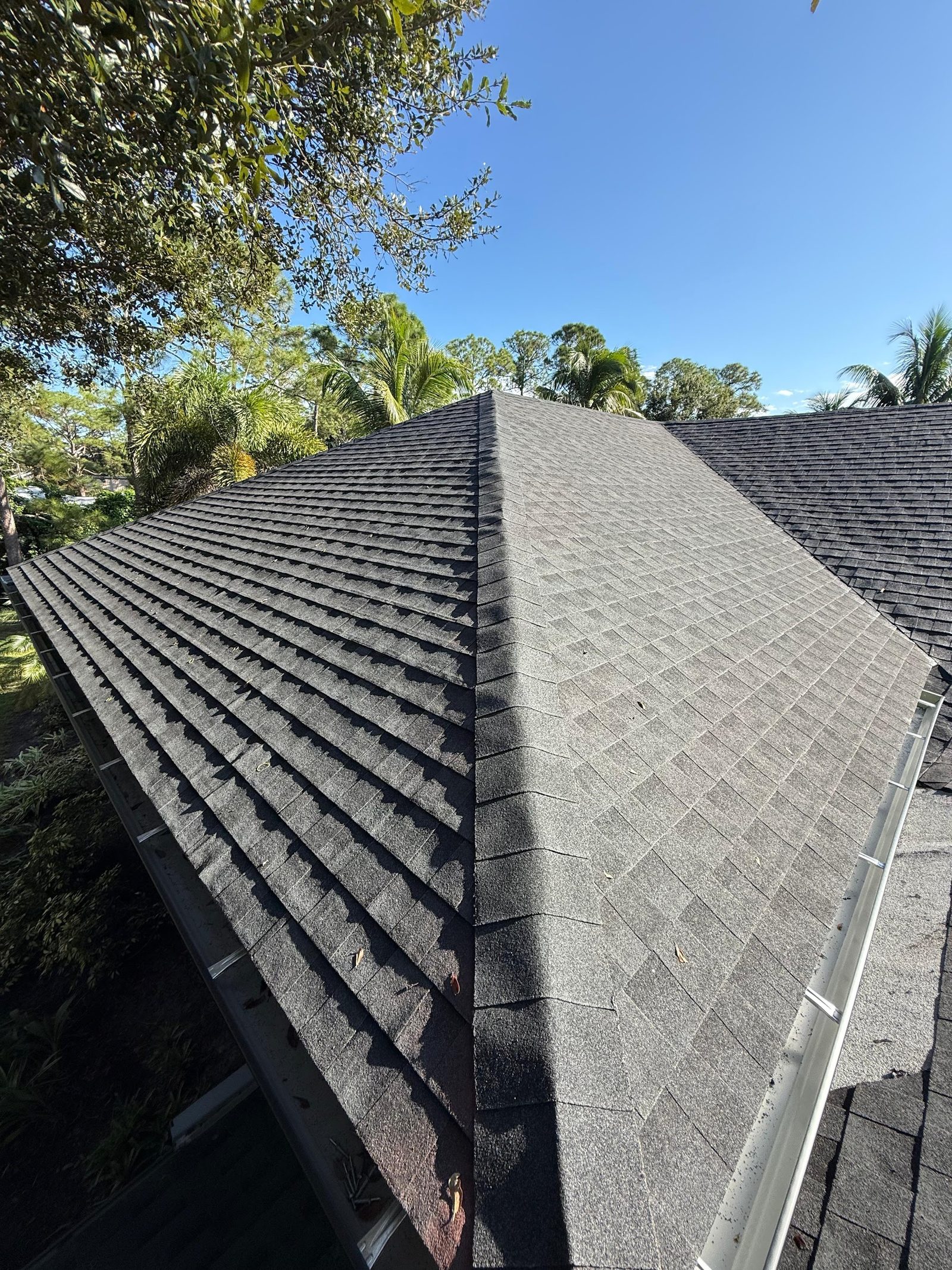 Ridge of a shingle roof in Florida showing cap detail