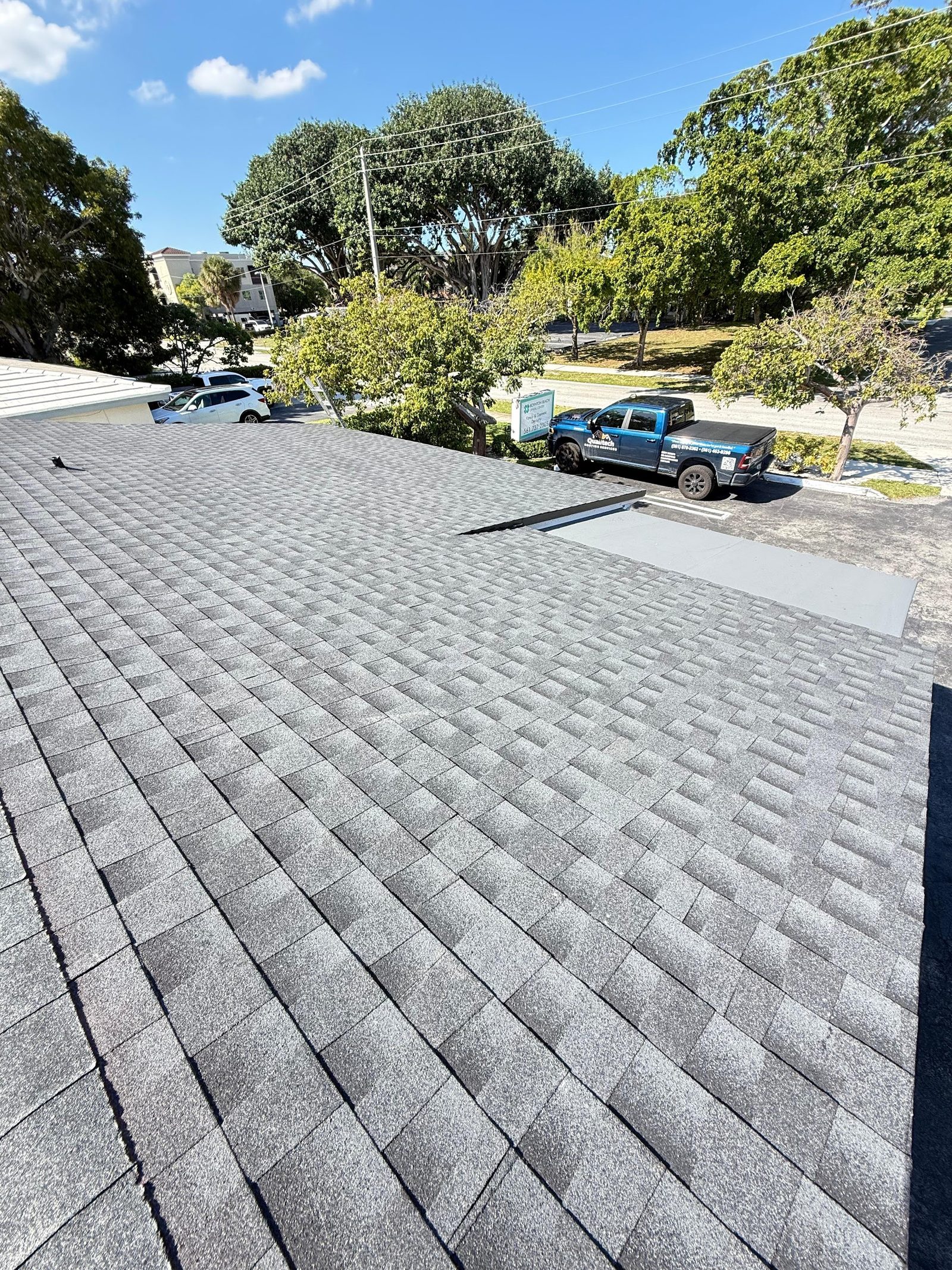 Roofing contractor truck at a Florida residential job site