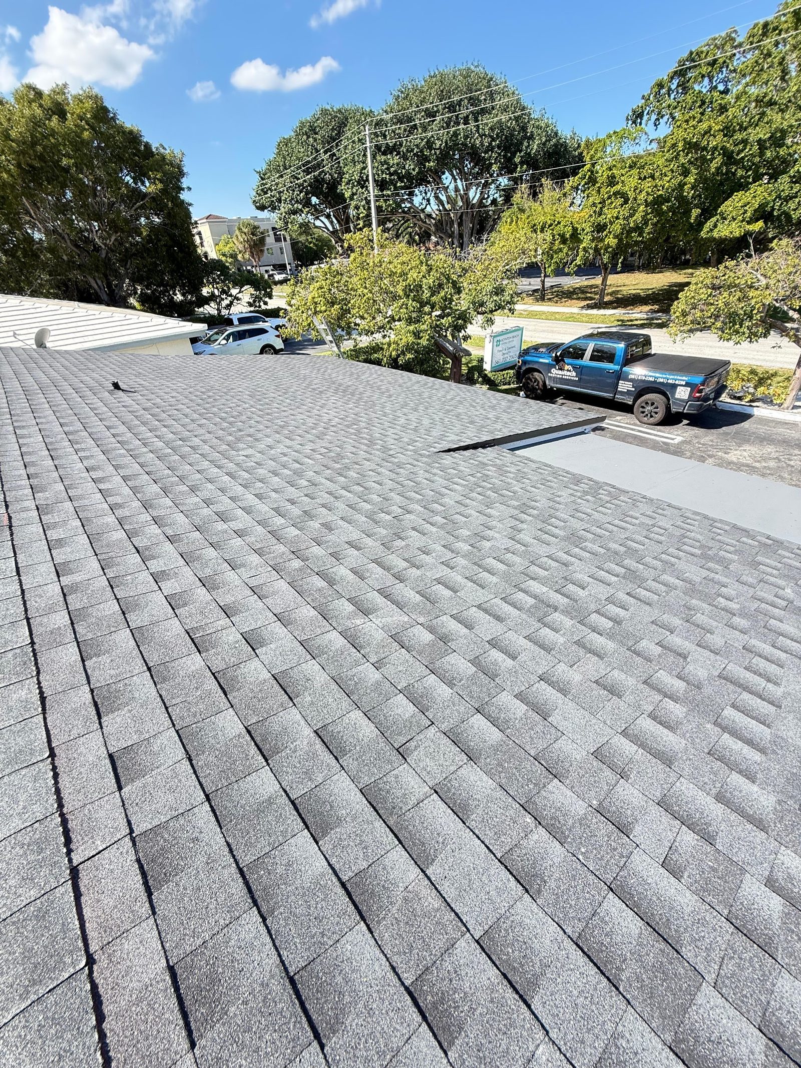 Wide view of a Florida shingle roof after storm season