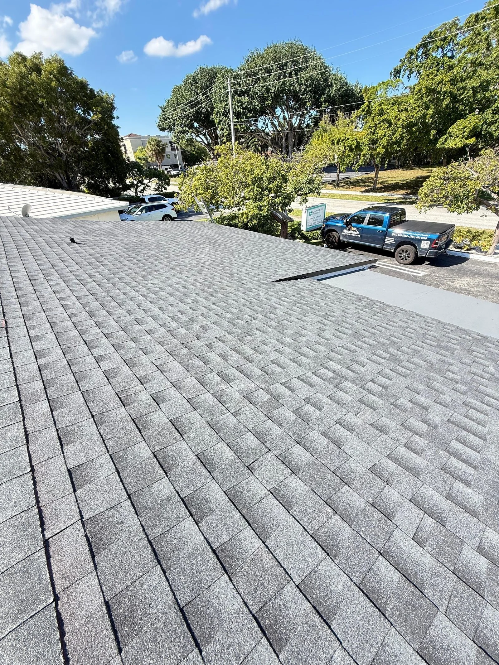 Wide view of a Florida shingle roof replacement ready for inspection